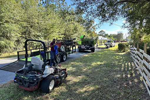 Lawn Care Company Employees Mowing a Commercial Lawn in Wesley Chapel Florida