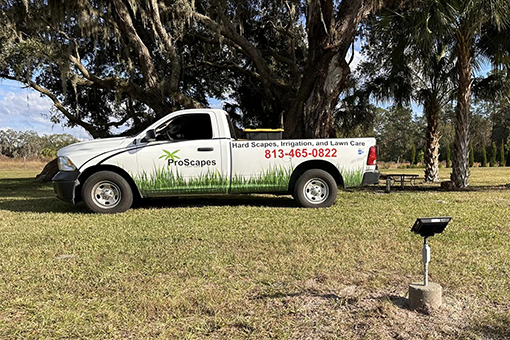 Vehicle of Wesley Chapel-based Lawn Care Company and Newly Installed Residential Landscape Lighting